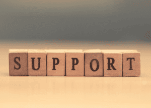 Wooden blocks spelling out the word support