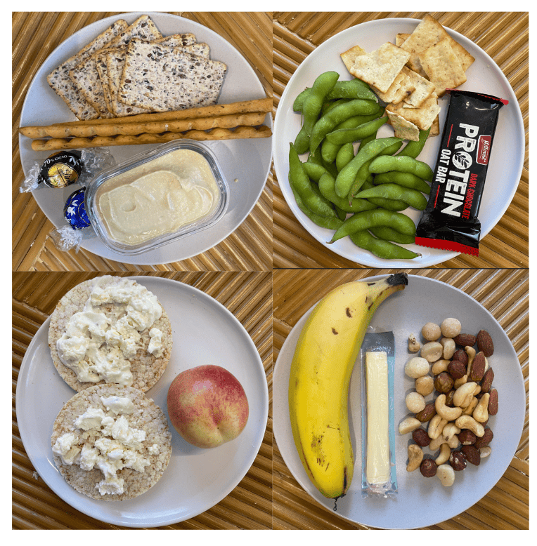 Four images of small dinner plates with snacks.Snacks on a bread roll sized plate. Banana, cheese stick and mixed nuts and yogurt coated sultanas A bread roll sized plate with two rice crackers with cottage cheese and a white nectarine. Bread roll sized plate with vita-weet crackers, bread sticks, lindt chocolates and hummus. A bread roll sized plate with edamame, crackers and a protein bar.