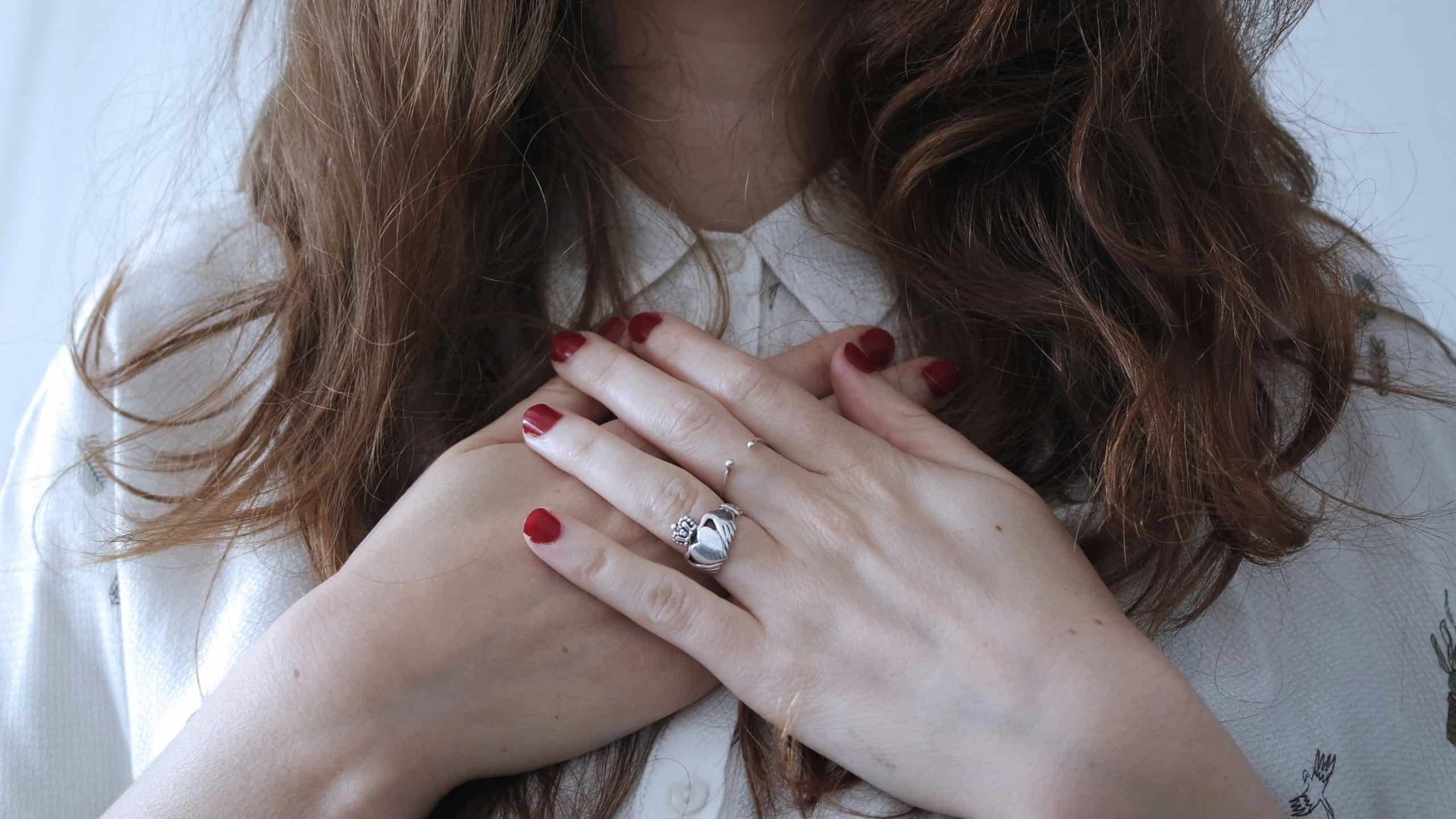 PCOS Self care Woman with hands over heart offering self compassion for PCOS challenges